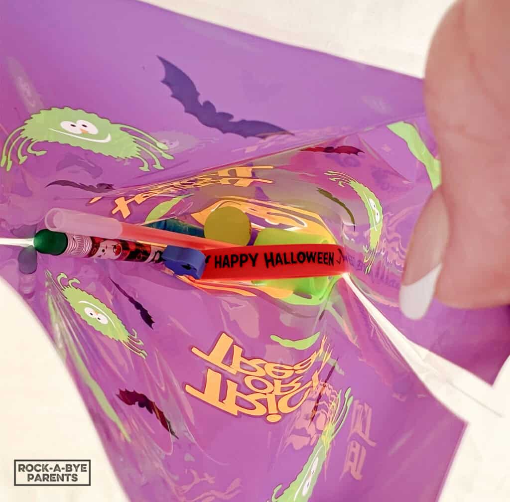 Closeup look at candy-free items inside goody bags for Halloween